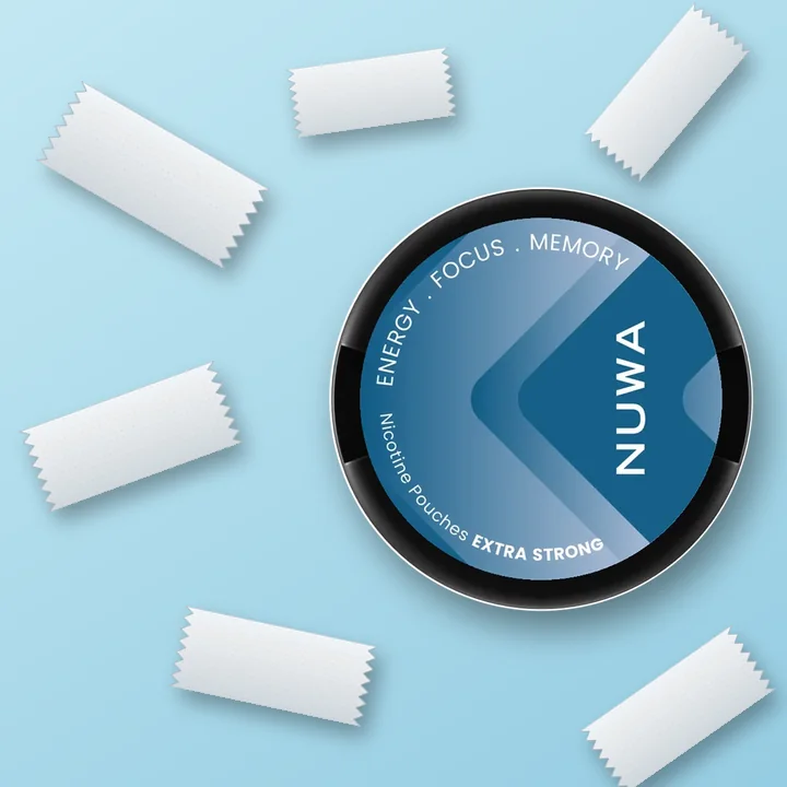 NUWA Mint tin with pouches scattered on a light blue surface